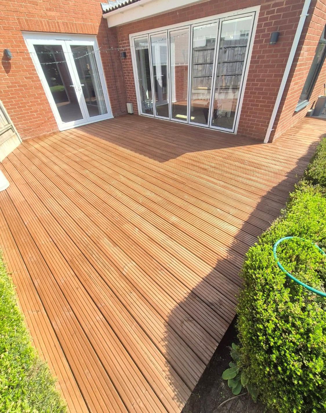 The same decking restored to golden timber