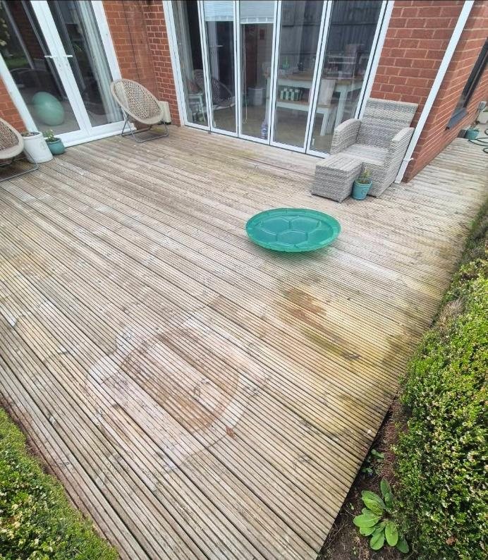 Grey weathered decking before cleaning