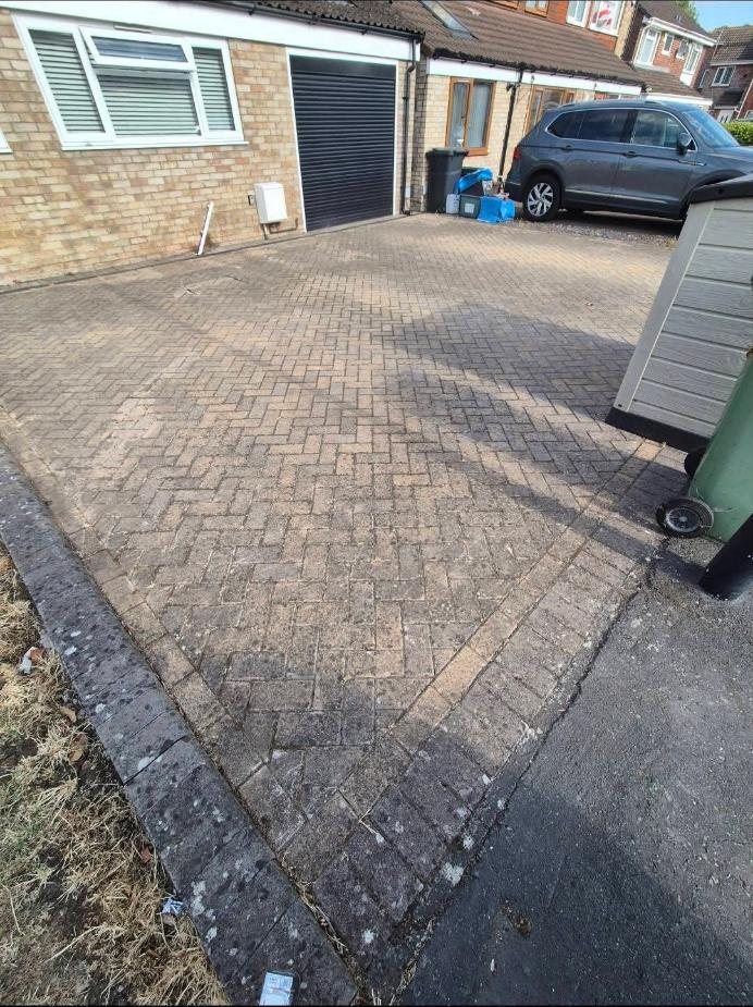 Stained front driveway before cleaning
